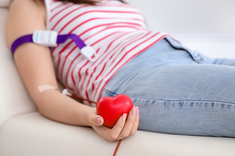 Young,Woman,With,Grip,Ball,Donating,Blood,In,Clinic,,Closeup